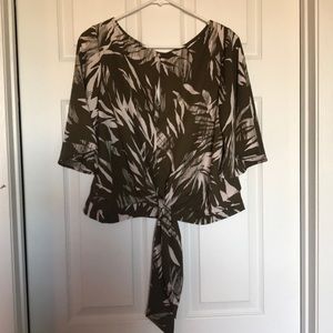 Floral print crop top with belled sleeves.